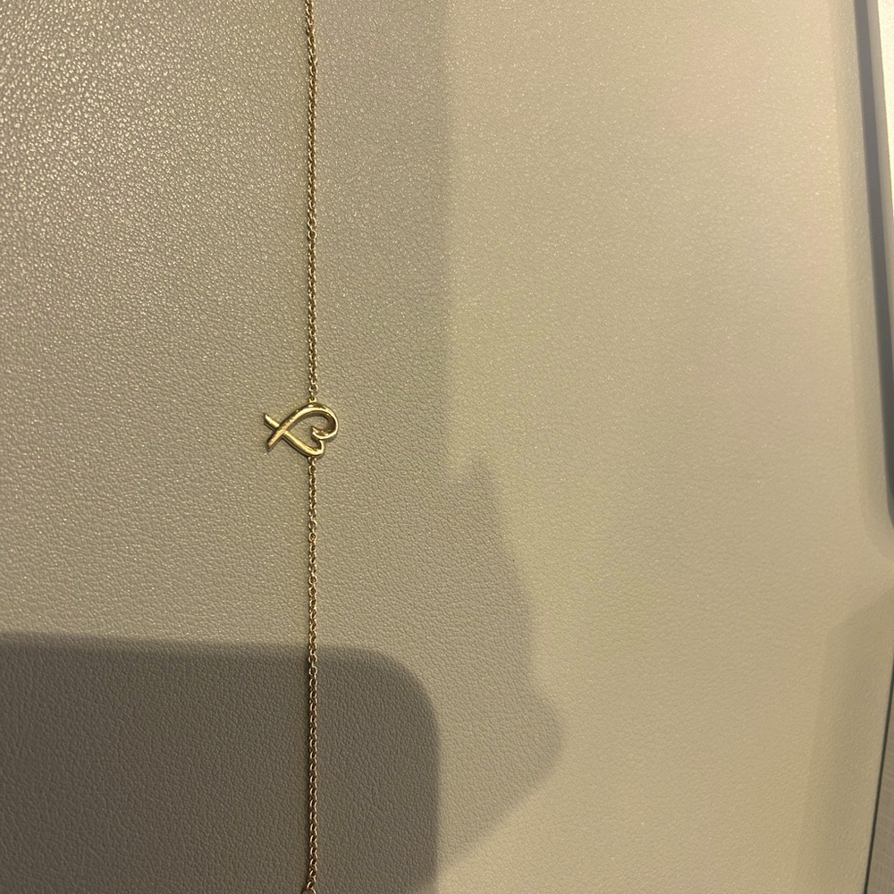 preowned Tiffany and Co. bracelet in 18k yellow gold, 7″ long.